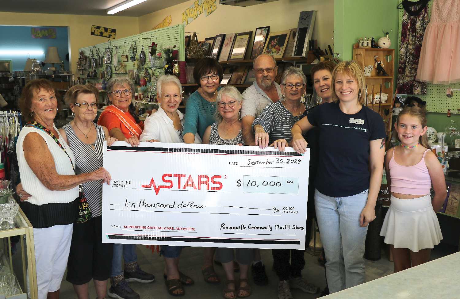 Venora Gagnier with STARS accepting a $10,000 cheque from the Rocanville Thrift Store Board